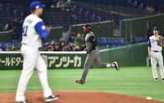 The Netherlands' Didi Gregorius (C) runs between the bases following his three-run homer in the top of the fourth inning during the World Baseball Classic Pool E second-round match against Israel in Tokyo, March 13, 2017. (AFP/Kazuhiro Nogi)
