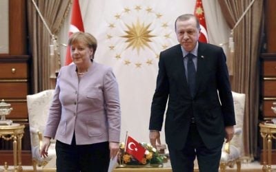 This file photo taken on February 2, 2017 shows Turkish President Recep Tayyip Erdogan (R) and German Chancellor Angela Merkel leaving after their meeting at the Presidential Palace in Ankara. (AFP PHOTO / ADEM ALTAN)