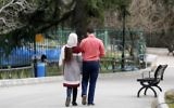 An Iranian couple walk in a park in the capital Tehran on March 14, 2017. (AFP/ATTA KENARE)