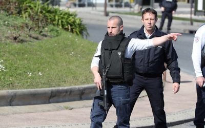 A French Policeman wearing a bulletproof jacket controls traffic on a road near the Tocqueville high school in the southern French town of Grasse, on March 16, 2017 following a shooting that left two people injured. (Valery Hache/AFP) A French Policeman wearing a bulletproof jacket controls traffic on a road near the Tocqueville high school in the southern French town of Grasse, on March 16, 2017 following a shooting that left two people injured. (Valery Hache/AFP)