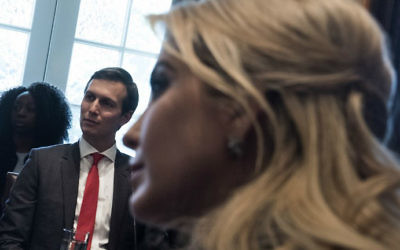 Senior Adviser Jared Kushner, left, and Ivanka Trump listen to introductions before a meeting with business leaders in the Cabinet Room of the White House March 17, 2017 in Washington, DC. (Brendan Smialowski/AFP)