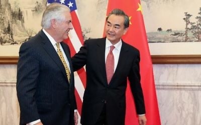 China's Foreign Minister Wang Yi (R) talks with US Secretary of State Rex Tillerson at the Diaoyutai State Guesthouse in Beijing on March 18, 2017. (AFP/Pool)