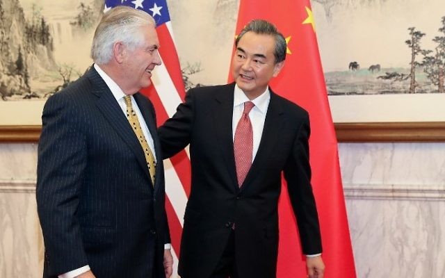 China's Foreign Minister Wang Yi (R) talks with US Secretary of State Rex Tillerson at the Diaoyutai State Guesthouse in Beijing on March 18, 2017. (AFP/Pool) China's Foreign Minister Wang Yi (R) talks with US Secretary of State Rex Tillerson at the Diaoyutai State Guesthouse in Beijing on March 18, 2017. (AFP/Pool)