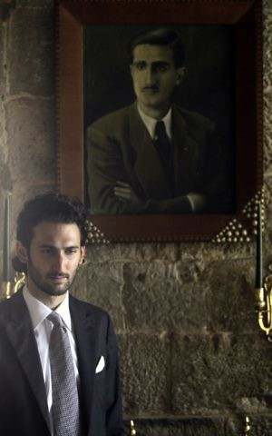 Taymur Jumblatt, son of Lebanese Druze leader Walid Jumblatt, walking past a painting of his late grandfather Kamal Jumblatt during a farewell lunch for an Israeli-Arab Druze delegation at Jumblatt's residence in Mukhtara, southeast of Beirut, July 24, 2010 (AFP PHOTO / Joseph EID)