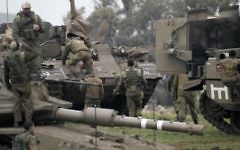Israeli soldiers take part in a military training in the Israeli-annexed Golan Heights, near the Israel-Syria border on March 20, 2017. (AFP/JALAA MAREY)