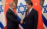 Prime Minister Benjamin Netanyahu and China's President Xi Jinping (R) shake hands ahead of their talks at Diaoyutai State Guesthouse in Beijing, on March 21, 2017. (AFP/Pool/Etienne Oliveau)