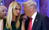 This file photo taken on January 11, 2017 shows US President-elect Donald Trump whispers to his daughter Ivanka during a press conference at Trump Tower in New York.  (AFP PHOTO / TIMOTHY A. CLARY)
