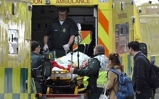 Paramedics load a victim into the back of an ambulance as members of the emergency services work on Westminster Bridge, alonside the Houses of Parliament in central London on March 22, 2017. (AFP Photo/Niklas Halle'n) Paramedics load a victim into the back of an ambulance as members of the emergency services work on Westminster Bridge, alonside the Houses of Parliament in central London on March 22, 2017. (AFP Photo/Niklas Halle'n)
