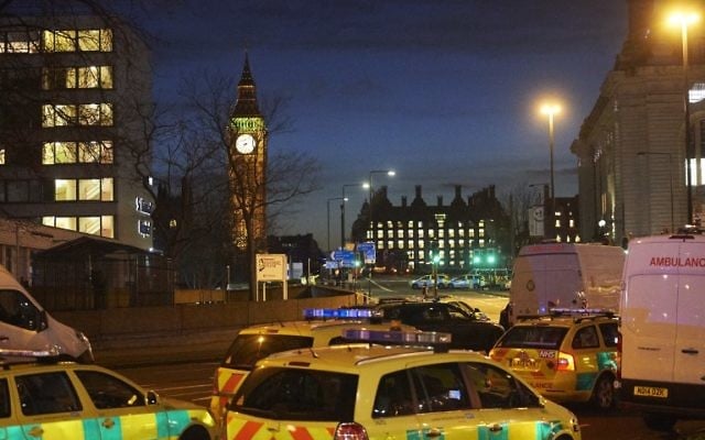 British police officers and emergency services work on Westminster Bridge, adjacent to the Houses of Parliament in Westminster, central London on March 22, 2017. (AFP/Niklas Halle'n) British police officers and emergency services work on Westminster Bridge, adjacent to the Houses of Parliament in Westminster, central London on March 22, 2017. (AFP/Niklas Halle'n)