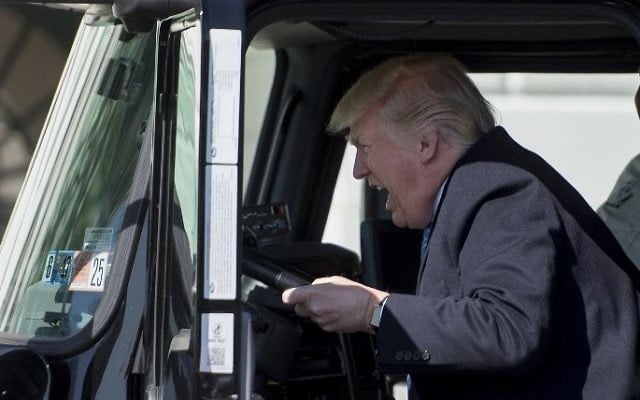 US President Donald Trump sits in the driver's seat of a semitrailer as he welcomes truckers and CEOs to the White House in Washington, DC, to discuss healthcare, March 23, 2017. (AFP/Jim Watson) US President Donald Trump sits in the driver's seat of a semitrailer as he welcomes truckers and CEOs to the White House in Washington, DC, to discuss healthcare, March 23, 2017. (AFP/Jim Watson)