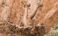 Participants take part in the Mud Day race, a 13km obstacle course, on March 24, 2017 in the Israeli Mediterranean coastal city of Tel Aviv. (Jack Guez/AFP)