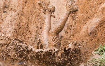 Participants take part in the Mud Day race, a 13km obstacle course, on March 24, 2017 in the Israeli Mediterranean coastal city of Tel Aviv. (Jack Guez/AFP)