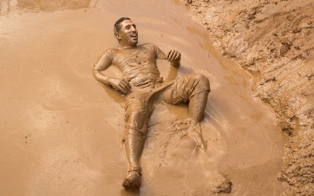Participants take part in the Mud Day race, a 13km obstacle course, on March 24, 2017 in the Israeli Mediterranean coastal city of Tel Aviv. (Jack Guez/AFP)