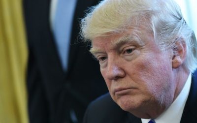 US President Donald Trump pauses as he speaks from the Oval Office of the White House in Washington, DC, on March 24, 2017. (AFP PHOTO / MANDEL NGAN)