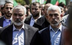 File: Yahya Sinwar, right, the new leader of Hamas in the Gaza Strip, and senior Hamas official Ismail Haniyeh attend the funeral of Hamas official Mazen Faqha in Gaza city on March 25, 2017. (AFP Photo/Mahmud Hams)