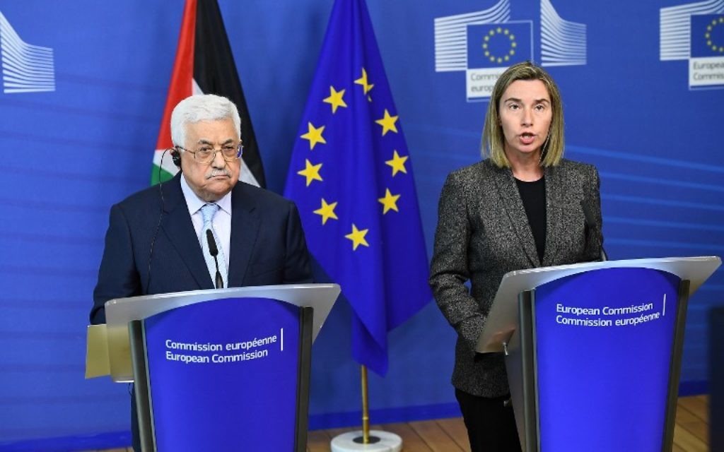 Palestinian Authority President Mahmoud Abbas (L) and EU foreign policy chief Federica Mogherini give a press conference following their meeting at the European Commission in Brussels on March 27, 2017. (AFP PHOTO / EMMANUEL DUNAND)