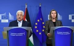 Palestinian Authority President Mahmoud Abbas (L) and EU foreign policy chief Federica Mogherini give a press conference following their meeting at the European Commission in Brussels on March 27, 2017. (AFP Photo/Emmanuel Dunand)