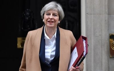 British Prime Minister Theresa May leaves 10 Downing Street before heading to the Houses of Parliament to attend the weekly Prime Minister's Questions (PMQs) in central London on March 29, 2017. (AFP/Ben Stansall) British Prime Minister Theresa May leaves 10 Downing Street before heading to the Houses of Parliament to attend the weekly Prime Minister's Questions (PMQs) in central London on March 29, 2017. (AFP/Ben Stansall)