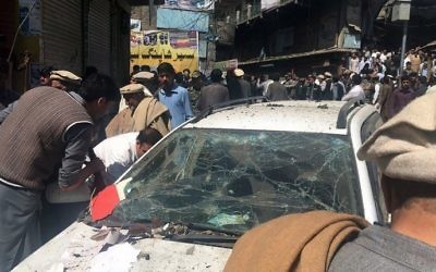 Pakistani residents gather at the site of a powerful explosion at a market in Parachinar, capital of the Kurram tribal district, on March 31, 2017. (AFP)