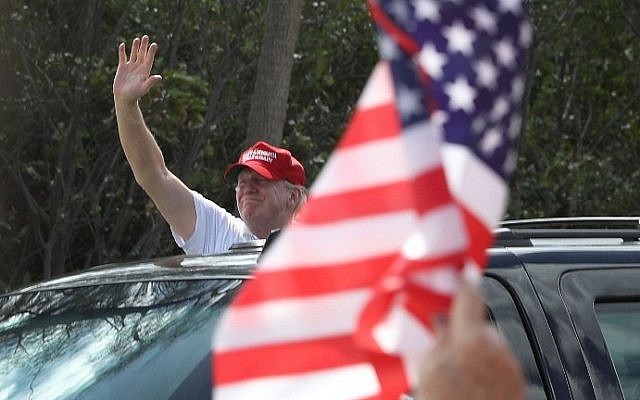US President Donald Trump waves to supporters near his Mar-a-Lago resort home on March 4, 2017 in West Palm Beach, Florida. (Joe Raedle/Getty Images/AFP)