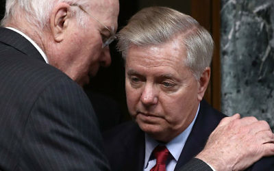 Sen. Patrick Leahy (D-Vermont), left, confers with Sen. Lindsey Graham (R-South Carolina), right, before the start of a hearing held by the Senate State, Foreign Operations and Related Programs Subcommittee March 7, 2017, in Washington, DC. (Win McNamee/Getty Images/AFP)