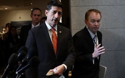 US Speaker of the House Paul Ryan (L) (R-WI) walks with OMB Director Mick Mulvaney (R) to a meeting of the House Republican caucus at the US Capitol on March 23, 2017. (Win McNamee/Getty Images/AFP)