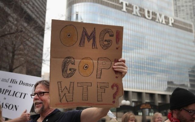 Demonstrators gather near Trump Tower to celebrate the defeat of President Donald Trump's revision of the Affordable Care Act (ACA) on March 24, 2017 in Chicago, Illinois. (Scott Olson/Getty Images/AFP)