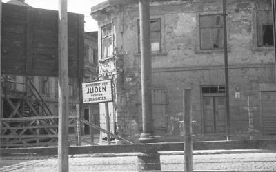 The Lodz ghetto residential area sign reading, 'Jews. Entry Forbidden.' (Henryk Ross/Art Gallery of Ontario, gift from the Archive of Modern Conflict/Courtesy Museum of Fine Arts)
