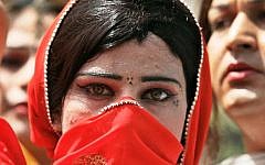 Illustrative image of a Pakistani woman covering her face in Saudi Arabia (screen capture: YouTube)