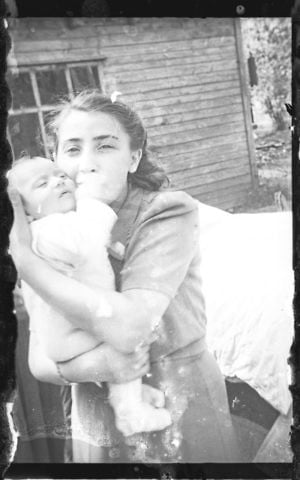 A damaged negative of a woman with her child, from a Ghetto policeman's family. (Henryk Ross/Art Gallery of Ontario, gift from the Archive of Modern Conflict/Courtesy Museum of Fine Arts) A damaged negative of a woman with her child, from a Ghetto policeman's family. (Henryk Ross/Art Gallery of Ontario, gift from the Archive of Modern Conflict/Courtesy Museum of Fine Arts)