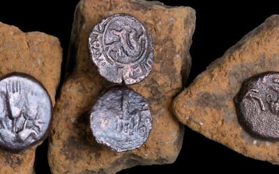 Ancient coins that were discovered in an excavation of a Roman road near Beit Shemesh in February 2017. (Clara Amit, courtesy of the Israel Antiquities Authority)