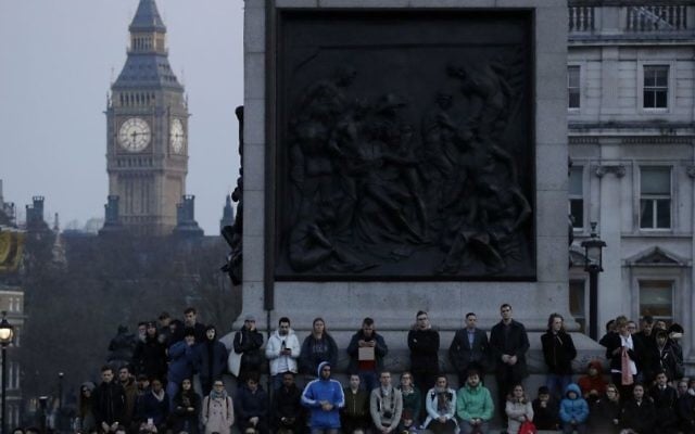 People observe a minutes silence at a vigil for the victims of Wednesday's attack, at Trafalgar Square in London, Thursday, March 23, 2017. (AP Photo/Matt Dunham) People observe a minutes silence at a vigil for the victims of Wednesday's attack, at Trafalgar Square in London, Thursday, March 23, 2017. (AP Photo/Matt Dunham)