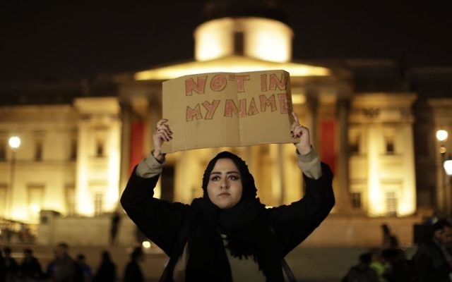 A woman holds up a sign at a vigil for the victims of Wednesday's attack, at Trafalgar Square in London, Thursday, March 23, 2017. (AP Photo/Matt Dunham) A woman holds up a sign at a vigil for the victims of Wednesday's attack, at Trafalgar Square in London, Thursday, March 23, 2017. (AP Photo/Matt Dunham)