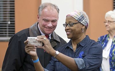 Democratic vice presidential candidate US Sen. Tim Kaine, D-Va., takes a selfie with a poll worker as he prepares to vote in Richmond, Va., Tuesday, Nov. 8, 2016 (AP Photo/Steve Helber)