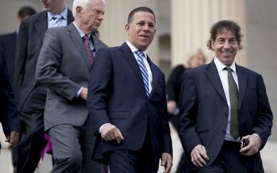 Then Rep.-elect Jamie Raskin, D-Md., right, Rep.-elect Anthony Brown, D-Md., second from right, and others, arrive for a newly-elected House members freshman class photo on the Capitol steps, Tuesday, Nov. 15, 2016, in Washington. (AP Photo/Andrew Harnik)