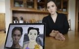Erin Schrode behind a laptop displaying anti-Semitic images of herself that she received via email and social media, February 21, 2017. (AP Photo/Eric Risberg)