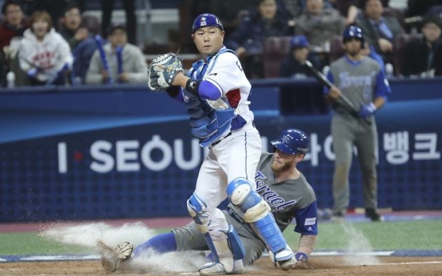 Israel's Zach Borenstein is forced out at home as South Korea's catcher Yang Eui-ji tries to throw to first during the eighth inning of the first round game of the World Baseball Classic at Gocheok Sky Dome in Seoul, South Korea, Monday, March 6, 2017. (AP /Lee Jin-man) Israel's Zach Borenstein is forced out at home as South Korea's catcher Yang Eui-ji tries to throw to first during the eighth inning of the first round game of the World Baseball Classic at Gocheok Sky Dome in Seoul, South Korea, Monday, March 6, 2017. (AP /Lee Jin-man)
