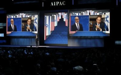Prime Minister Benjamin Netanyahu is projected on screen in Washington, Monday, March 27, 2017, as he speaks to attendees of the AIPAC Policy Conference 2017 via satellite from Israel (AP Photo/Manuel Balce Ceneta)