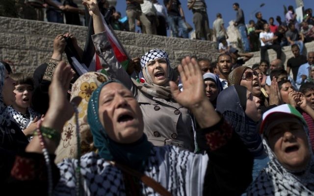 Palestinian women shout slogans at Damascus Gate, outside Jerusalem's old city, Friday, Sept. 27, 2013 marking the 13th anniversary of the second Palestinian uprising against Israeli occupation. (AP Photo/Bernat Armangue) Palestinian women shout slogans at Damascus Gate, outside Jerusalem's old city, Friday, Sept. 27, 2013 marking the 13th anniversary of the second Palestinian uprising against Israeli occupation. (AP Photo/Bernat Armangue)