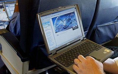 Illustrative photo of a laptop is used on a plane. (Chris Ison/PA, File via AP)