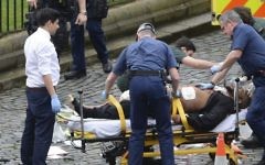 In this March 22, 2017 photo, Khalid Masood is treated by emergency services after a fatal attack outside the Houses of Parliament, London. British Police named Masood on March 23, 2017, as the terrorist who carried out the attack. (Stefan Rousseau/PA via AP).