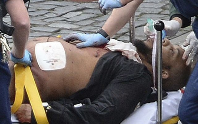 London attacker Khalid Masood is treated by emergency services outside the Houses of Parliament London, March 22, 2017. (Stefan Rousseau/PA via AP) London attacker Khalid Masood is treated by emergency services outside the Houses of Parliament London, March 22, 2017. (Stefan Rousseau/PA via AP)