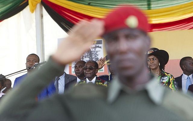In this Saturday, Feb. 25, 2017 file photo, President Robert Mugabe, center, and his wife Grace, right, attend his 93rd birthday celebrations in Matopos on the outskirts of Bulawayo, Zimbabwe. (AP/Tsvangirayi Mukwazhi)