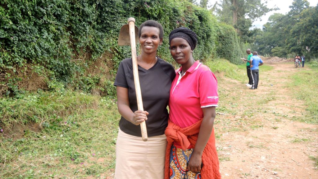 Yvonne Nshuti, left, with a neighbor during the monthly Umuganda community service day in Kigali, Rwanda on February 25, 2017. (Melanie Lidman/Times of Israel)