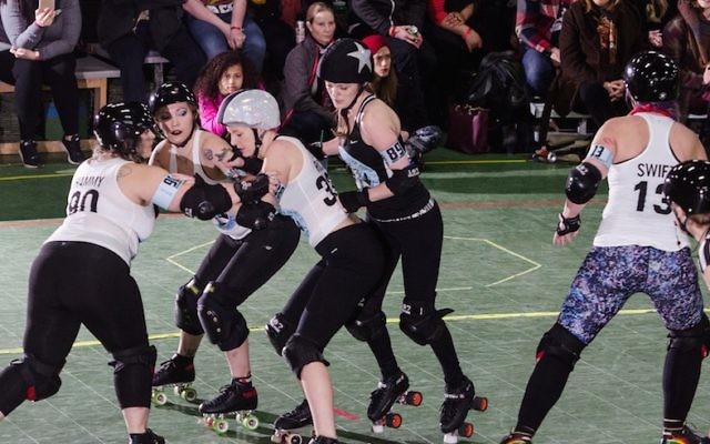 Dara Fineman, left, gets involved in some Gotham Girls Roller Derby League action in a match in Brooklyn, N.Y., March 19, 2017. (Sean Hale/JTA) Dara Fineman, left, gets involved in some Gotham Girls Roller Derby League action in a match in Brooklyn, N.Y., March 19, 2017. (Sean Hale/JTA)