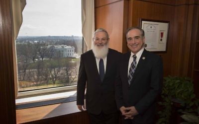 Deputy Defense Minister Eli Ben Dahan, left, and US Secretary of Veterans Affairs David Shulkin pose in the latter's Washington, DC, office on March 28, 2017. (Courtesy: Deputy Defense Minister Eli Ben Dahan)