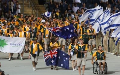 Athletes from the Australian delegation wave their national flags during the opening ceremony of the Maccabiah Games in Jerusalem, Israel, July 18, 2013. (Yonatan Sindel/Flash90) Athletes from the Australian delegation wave their national flags during the opening ceremony of the Maccabiah Games in Jerusalem, Israel, July 18, 2013. (Yonatan Sindel/Flash90)