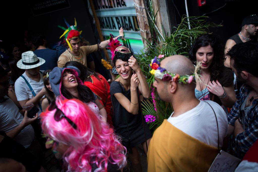 Partying on Purim 2016 at a Tel Aviv bar (Miriam Alster/Flash 90) Partying on Purim 2016 at a Tel Aviv bar (Miriam Alster/Flash 90)