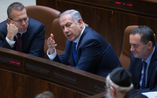 Prime Minister Benjamin Netanyahu speaks with Minister of Public Security and Strategic Affairs, Gilad Erdan (L) at the Israeli parliament during a plenum session in the assembly hall of the Israeli parliament on March 28, 2016. (Yonatan Sindel/Flash90) Prime Minister Benjamin Netanyahu speaks with Minister of Public Security and Strategic Affairs, Gilad Erdan (L) at the Israeli parliament during a plenum session in the assembly hall of the Israeli parliament on March 28, 2016. (Yonatan Sindel/Flash90)