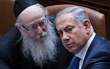 Prime Minister Benjamin Netanyahu, right, speaks with then-health minister Yaakov Litzman of the United Torah Judaism party, left, at the Knesset on March 28, 2016. (Yonatan Sindel/Flash90/File)